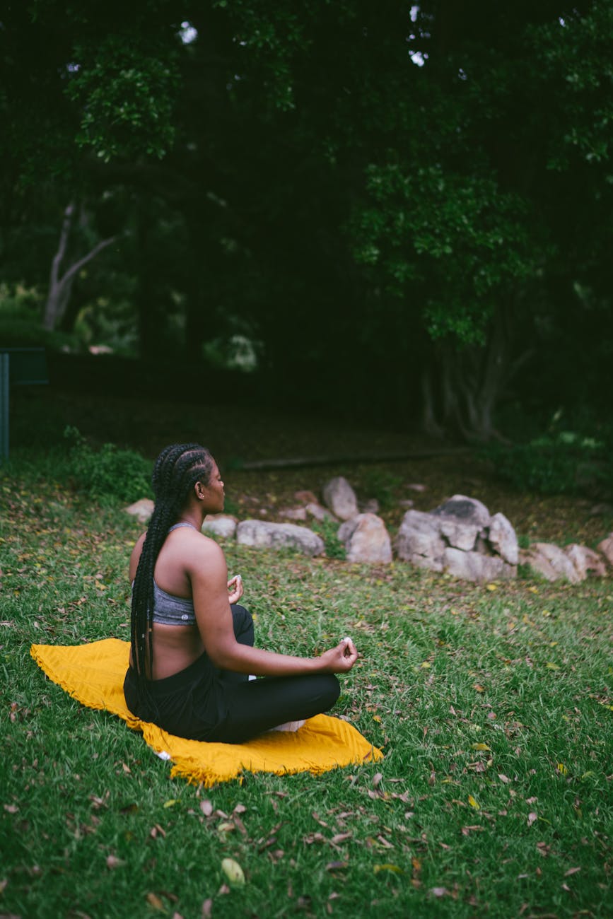 photo of woman doing meditation - luxury self-care