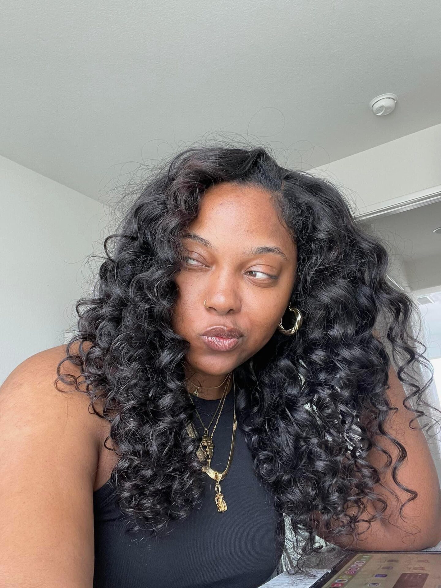 Morgan Ashley — natural skin, no makeup, curly hair, gold jewelry — skincare for melanin-rich skin at 40